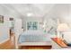 Light and airy main bedroom with tray ceilings, ceiling fan, and a large window at 2737 Old Forest Dr, Seabrook Island, SC 29455