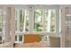 Bright sunroom with floor to ceiling windows, natural light, and view of the lush backyard at 2737 Old Forest Dr, Seabrook Island, SC 29455