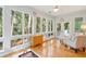 Sunroom filled with natural light, offering views of the backyard at 2737 Old Forest Dr, Seabrook Island, SC 29455