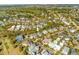 Wide aerial shot of the real estate in relation to the surrounding golf courses and community at 278 Furman Farm Pl, Daniel Island, SC 29492