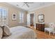 Bright bedroom features hardwood floors and shutters for a sun-soaked relaxing interior at 278 Furman Farm Pl, Daniel Island, SC 29492