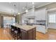 Beautiful kitchen featuring a large center island with granite countertops and seating at 278 Furman Farm Pl, Daniel Island, SC 29492