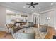 Spacious living room open to kitchen, featuring hardwood floors and stylish decor at 278 Furman Farm Pl, Daniel Island, SC 29492