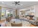 Inviting living room with hardwood floors, ample seating, and access to the outdoors at 278 Furman Farm Pl, Daniel Island, SC 29492