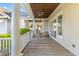 Spacious covered porch with wood ceiling and outdoor seating at 278 Furman Farm Pl, Daniel Island, SC 29492