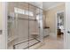 Spacious walk-in shower featuring bench seating, dual shower heads, and elegant tile design at 278 Furman Farm Pl, Daniel Island, SC 29492
