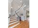 Elegant foyer with hardwood floors and a staircase to the second floor at 278 Furman Farm Pl, Daniel Island, SC 29492