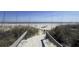 Sandy path leading to a secluded beach, surrounded by dunes at 2906 Palm Blvd, Isle of Palms, SC 29451