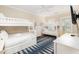 Spacious bunk room features four twin beds, a ceiling fan, and a flat screen television at 2906 Palm Blvd, Isle of Palms, SC 29451