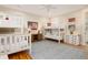 Spacious bunkroom featuring two sets of bunkbeds, hardwood flooring, and soft area rug at 2906 Palm Blvd, Isle of Palms, SC 29451