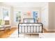 Bright bedroom with hardwood floors, natural light, and a comfortable bed at 2906 Palm Blvd, Isle of Palms, SC 29451