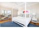 Bright bedroom featuring a large bed, neutral walls, and reading nook with seating at 2906 Palm Blvd, Isle of Palms, SC 29451