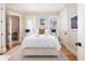 Bright bedroom with a neutral colored palette, hardwood floors and a soft area rug at 2906 Palm Blvd, Isle of Palms, SC 29451
