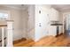 Hallway leading to stairs, a storage room, and a beverage area at 2906 Palm Blvd, Isle of Palms, SC 29451