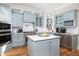 Well-equipped kitchen featuring custom cabinets, stone countertops, and island at 2906 Palm Blvd, Isle of Palms, SC 29451