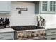 Updated kitchen features stainless steel oven, pot filler, white subway tile, and bright countertops at 2906 Palm Blvd, Isle of Palms, SC 29451