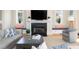 Cozy living room featuring a fireplace, built-in seating, and natural light at 2906 Palm Blvd, Isle of Palms, SC 29451