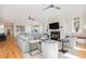 Spacious living room with fireplace, hardwood floors, and comfortable seating at 2906 Palm Blvd, Isle of Palms, SC 29451