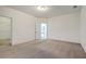 Large bedroom with neutral carpet and a walk-in closet, providing ample storage space at 3073 Moonlight Dr, Charleston, SC 29414