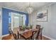Chic dining room with a decorative chandelier, stylish table setting, and designer accents at 3073 Moonlight Dr, Charleston, SC 29414