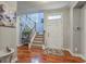 Bright foyer with hardwood floors, staircase, and a glimpse into other rooms at 3073 Moonlight Dr, Charleston, SC 29414