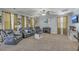 Bright living room showcasing leather furniture, carpet flooring, and natural light at 3073 Moonlight Dr, Charleston, SC 29414