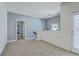 Open loft area with carpeting and a door, creating a versatile and inviting space for various uses at 3073 Moonlight Dr, Charleston, SC 29414