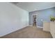 Spacious loft area with carpeting and natural light, ideal for a home office, play area, or additional living space at 3073 Moonlight Dr, Charleston, SC 29414