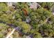 Aerial view of a home nestled in a lush, maturely wooded lot at 3180 Pine Needle Ln, Seabrook Island, SC 29455