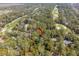 Aerial view of a home nestled amongst trees near a golf course at 3180 Pine Needle Ln, Seabrook Island, SC 29455