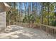 Large back deck is surrounded by lush greenery and trees, offering a peaceful outdoor space at 3180 Pine Needle Ln, Seabrook Island, SC 29455