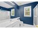 Bathroom featuring a shower and vanity sink with a framed mirror above at 3180 Pine Needle Ln, Seabrook Island, SC 29455