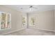 Neutral bedroom with large windows providing ample natural light and a ceiling fan at 3180 Pine Needle Ln, Seabrook Island, SC 29455
