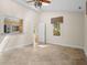 Another view of the well-lit bedroom with windows and views to the kitchen at 3180 Pine Needle Ln, Seabrook Island, SC 29455