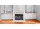 Cozy fireplace with tile surround and built-in shelving in a neutral-toned living area at 3180 Pine Needle Ln, Seabrook Island, SC 29455