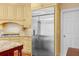 Stainless steel refrigerator and matching cabinets, next to a doorway that leads to a pantry area at 3180 Pine Needle Ln, Seabrook Island, SC 29455