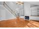 Bright living room with vaulted ceiling, hardwood floors, fireplace, and built-in shelving at 3180 Pine Needle Ln, Seabrook Island, SC 29455