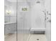 A glass enclosed shower includes a shower bench, handheld sprayer, and recessed shelving at 3180 Pine Needle Ln, Seabrook Island, SC 29455