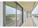 Long balcony with windows offering distant city views at 330 Concord St # 7E, Charleston, SC 29401