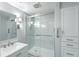 Stylish bathroom with glass shower, built-in storage, and modern fixtures at 330 Concord St # 7E, Charleston, SC 29401