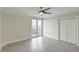 Bright bedroom featuring a ceiling fan, sliding glass doors to a balcony, and a view at 330 Concord St # 7E, Charleston, SC 29401