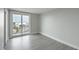 Bedroom with large sliding glass door and hardwood floors at 330 Concord St # 7E, Charleston, SC 29401
