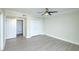 Spacious bedroom featuring a ceiling fan and a connected bathroom with neutral colors at 330 Concord St # 7E, Charleston, SC 29401