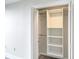 Walk-in closet featuring custom shelving and ample storage space at 330 Concord St # 7E, Charleston, SC 29401