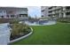 Relaxing courtyard with green space, comfortable seating, and scenic landscaping for a serene outdoor experience at 330 Concord St # 7E, Charleston, SC 29401