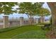 Manicured green space near the water with wrought iron fencing and mature trees at 330 Concord St # 7E, Charleston, SC 29401