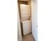 Efficient laundry area featuring a stacked washer and dryer unit in a compact space at 330 Concord St # 7E, Charleston, SC 29401