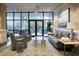 Inviting lobby area with comfortable seating, stylish decor, and large windows at 330 Concord St # 7E, Charleston, SC 29401
