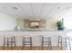 Stylish bar area with granite countertops, seating for four, and tasteful decor at 330 Concord St # 7E, Charleston, SC 29401