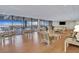 Bright lounge area with floor-to-ceiling windows offering scenic waterfront views and ample seating at 330 Concord St # 7E, Charleston, SC 29401